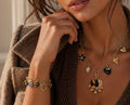 BRACELET BRELOQUES COEURS LEOPARD ET COEURS NOIRS