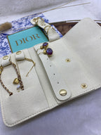 SAC RANGE BIJOUX  EN SUEDINE ECRU